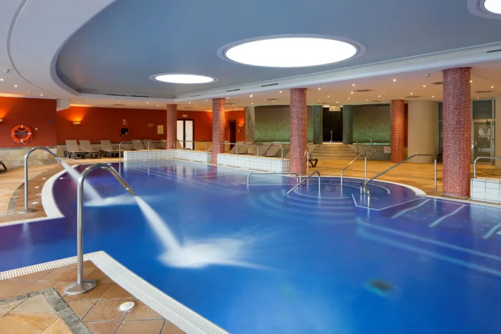 Indoor pool with jets at the spa at Son Antem