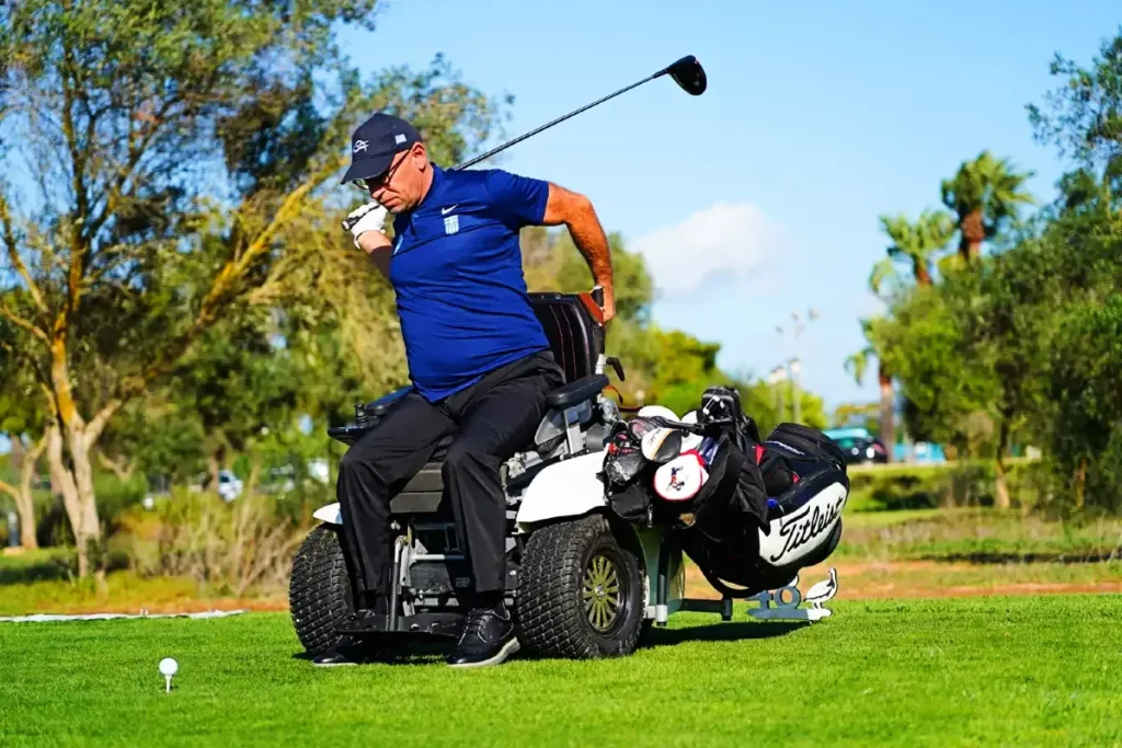 ParaGolfer taking a swing at the golf ball from the tee.