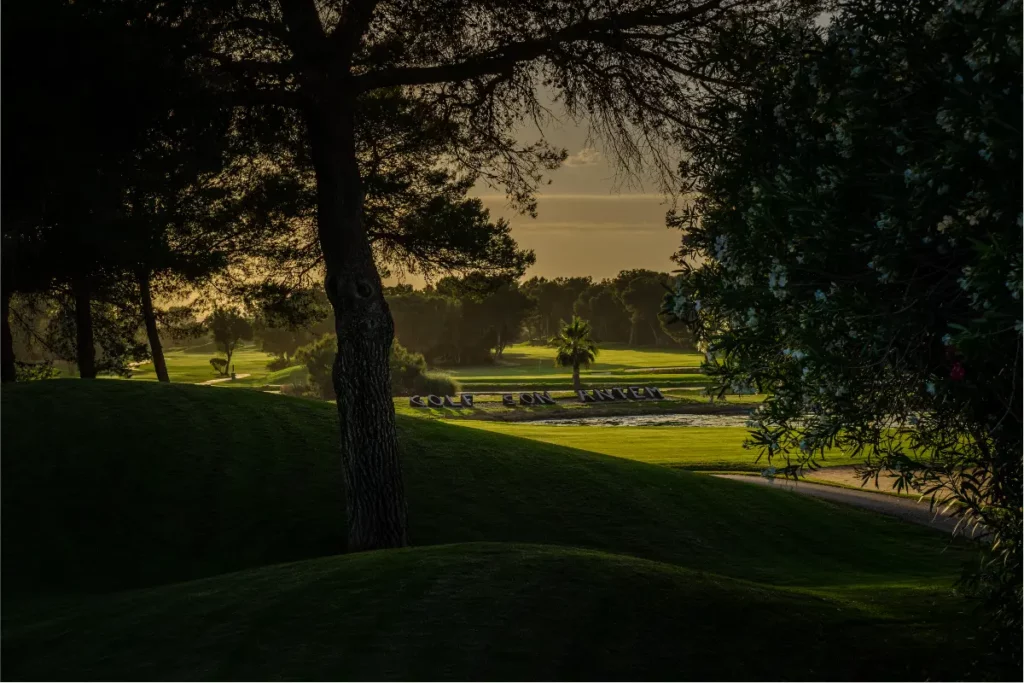 Son Antem West Golf Course View of Hole 18 through trees in Mallorca