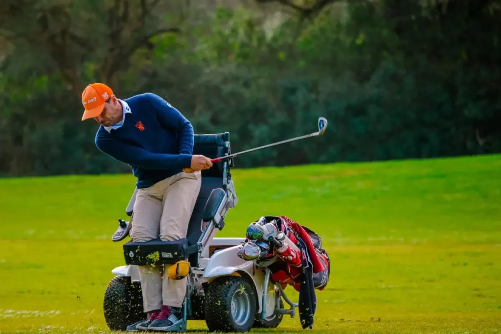 Golfer standing with the use of the ParaGolfer swinging the club