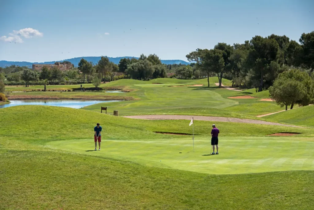 Son Antem West Golf Course View of Hole 17 Green with Golfers Putting in Mallorca