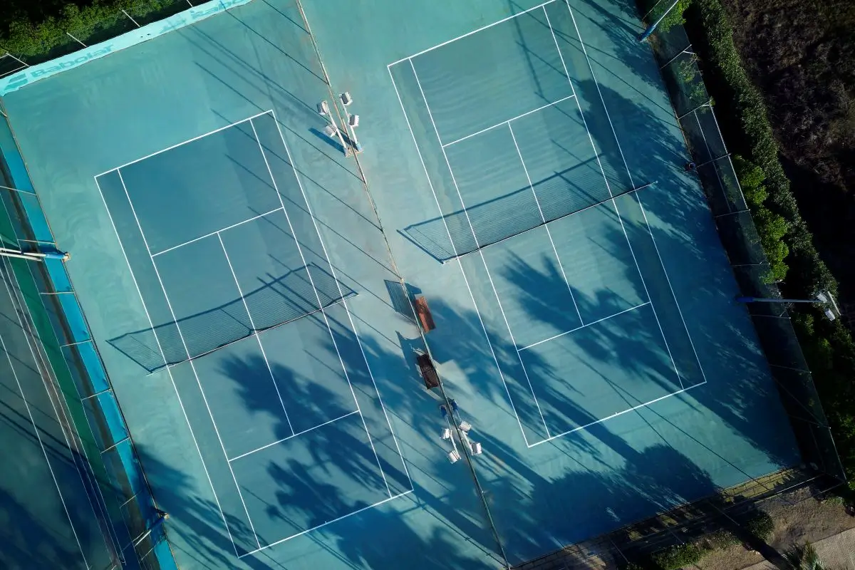 Overhead shot of tennis courts at Son Antem showcasing the court layout.
